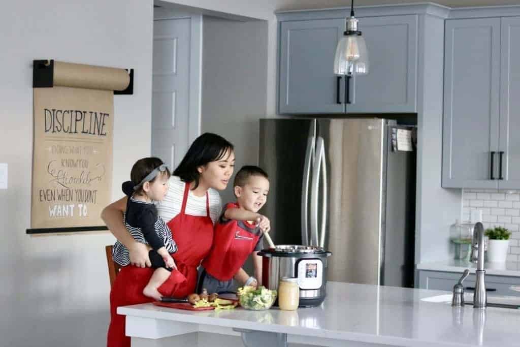 Lisa Childs cooking with her Instant Pot in her kitchen