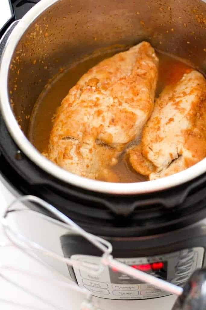 Instant Pot frozen chicken is cooked in 20 minutes, ready to be shredded!