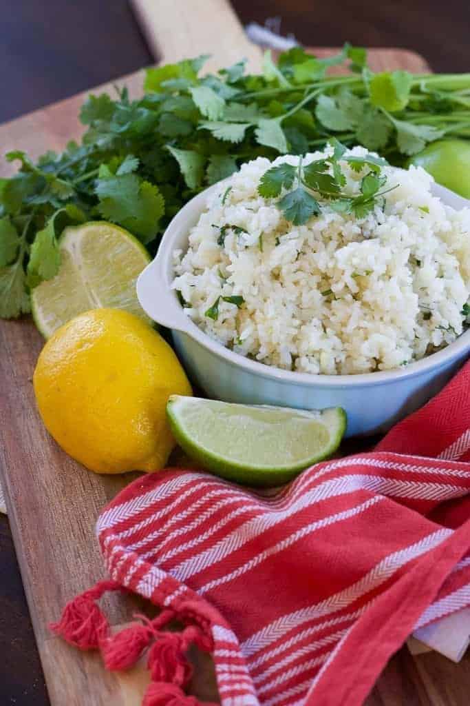 This cilantro lime rice recipe is super easy! Make Instant Pot rice and add lemon juice, lime juice, and cilantro to make a yummy mexican rice side dish. Perfect cinco de mayo food! | Tried Tested and True Instant Pot Cooking by Lisa Childs