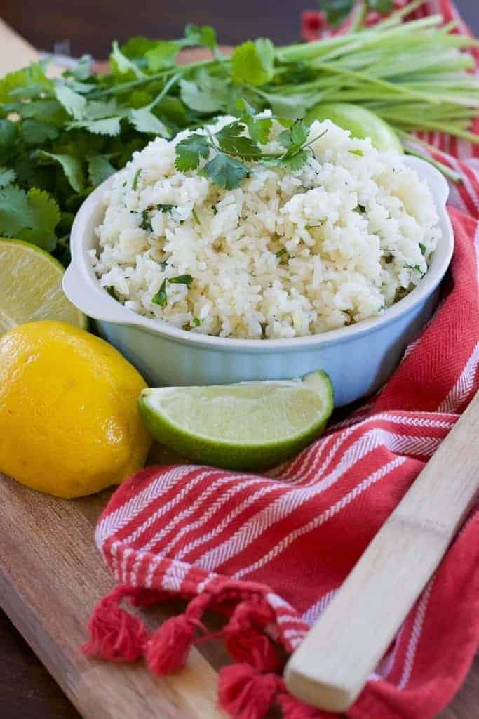This cilantro lime rice recipe is super easy! Make Instant Pot rice and add lemon juice, lime juice, and cilantro to make a yummy mexican rice side dish. Perfect cinco de mayo food! | Tried Tested and True Instant Pot Cooking by Lisa Childs