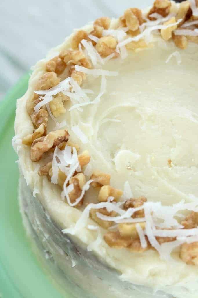 Carrot Cake with cream cheese frosting and coconut walnut garnish