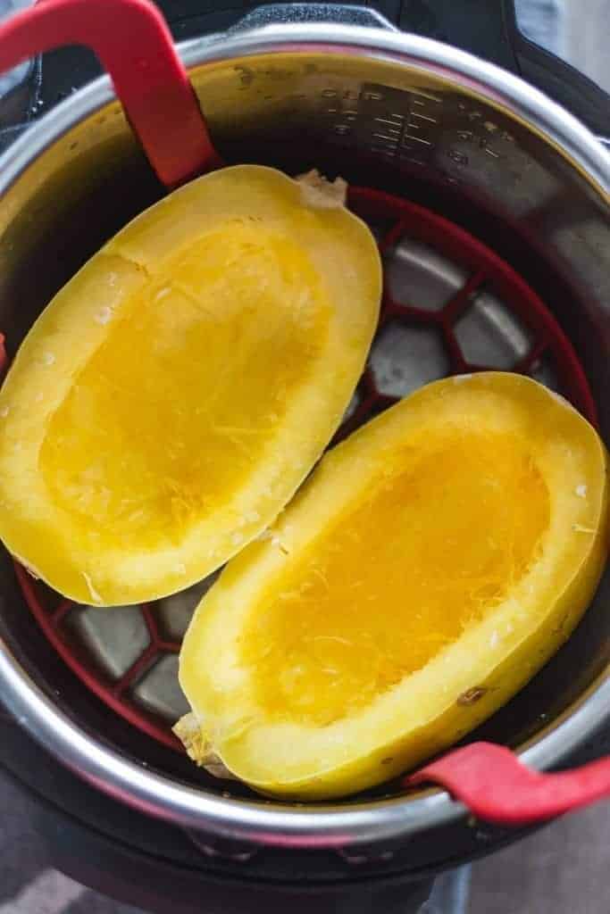two spaghetti squash halves in an instant pot pressure cooker