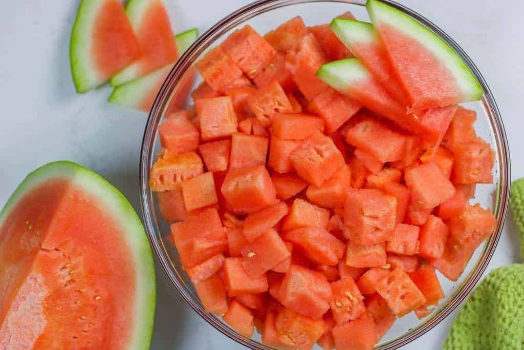 a bowl of watermelon cut into cubes 
