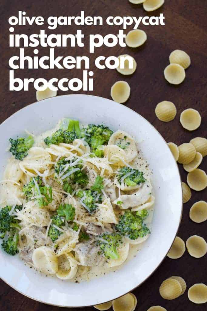 a bowl of chicken con broccoli on a dark background with orecchiette noodles