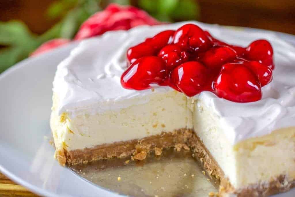 a whole instant pot cheesecake with cherry topping