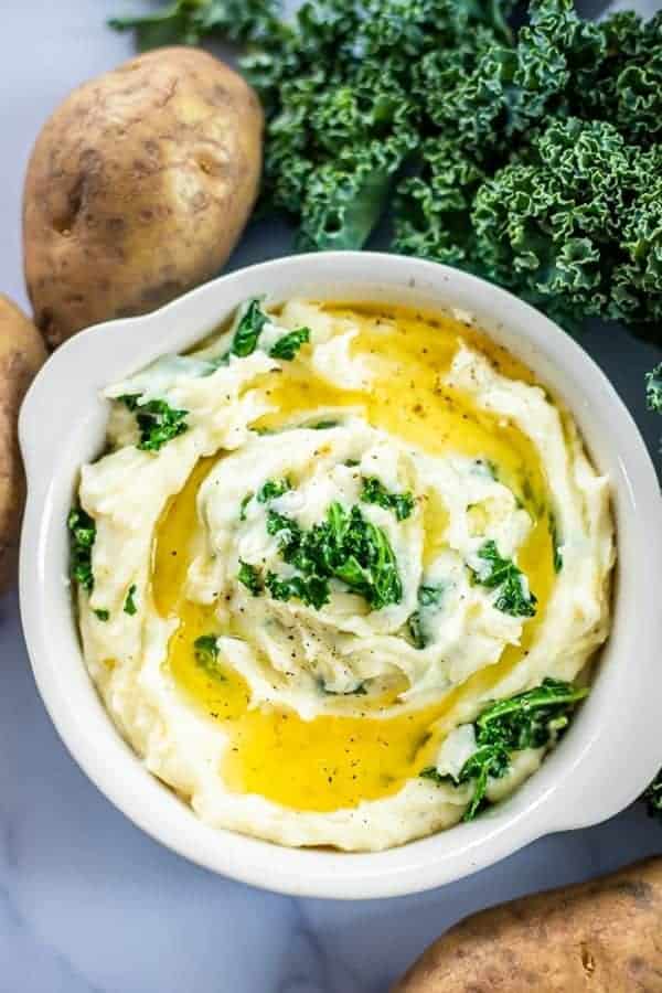 A BLUE DISH with colcannon potatoes, kale, and potatoes