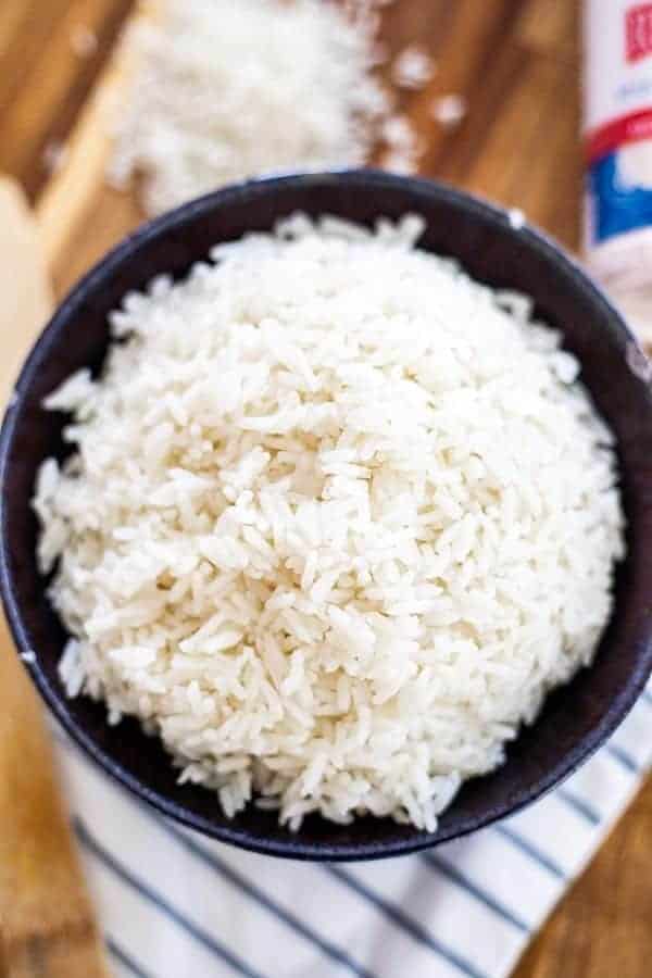 a big bowl of white rice in a blue bowl