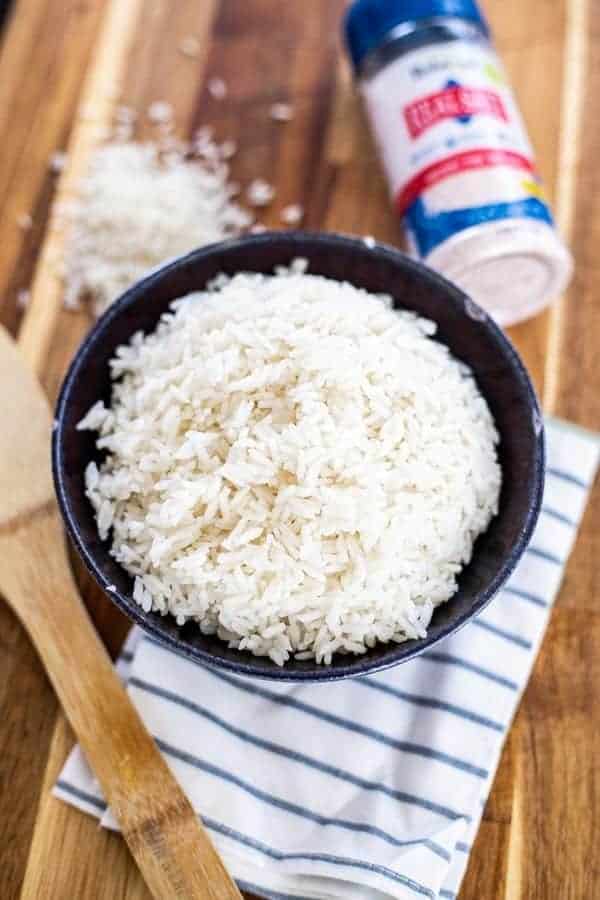 Instant Pot Rice with a paddle, napkin, and salt shaker