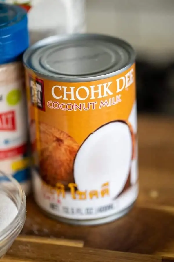 an unopened can of chohk dee coconut milk