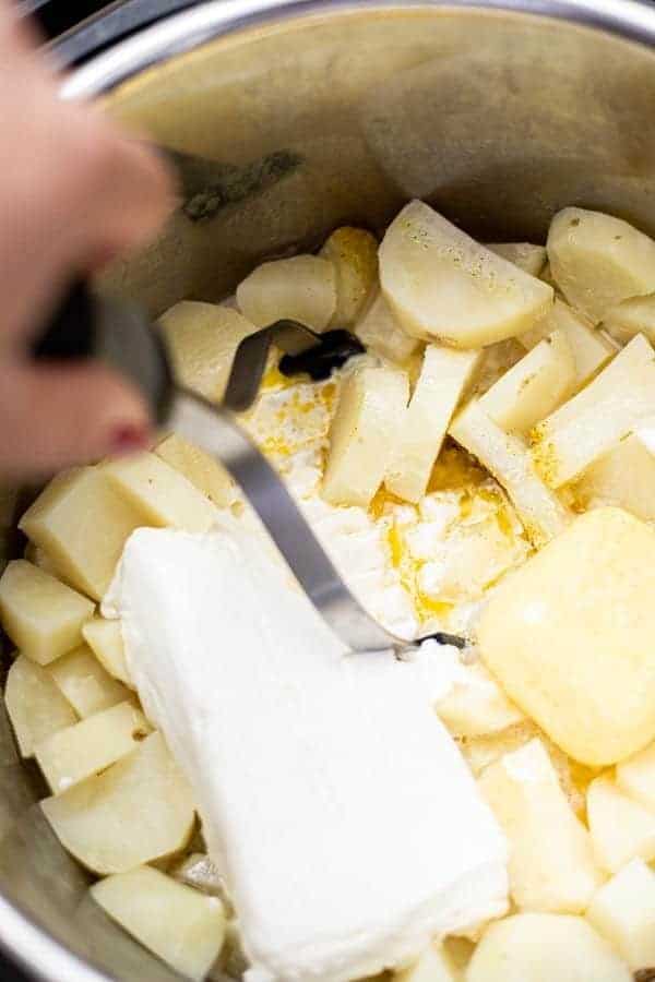 potato masher mashing potatoes