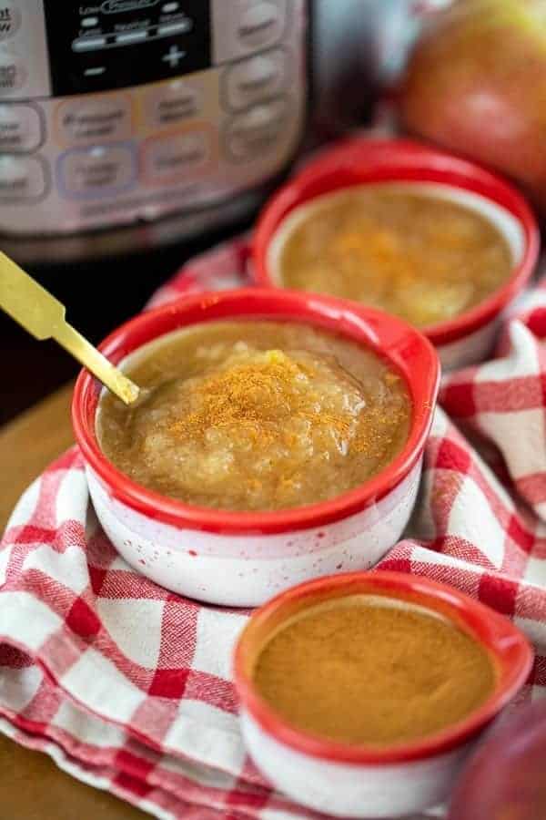 three small bowls of Instant Pot applesauce