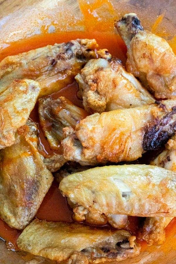 cooked chicken wings in buffalo sauce