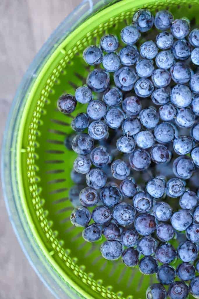 blueberries floating in vinegar water