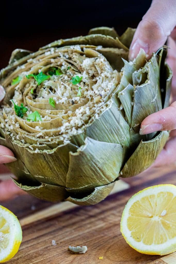 pulling apart an artichoke