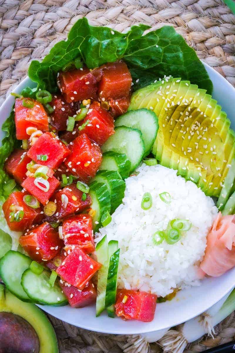 a bowl of tuna poke with avocado and rice