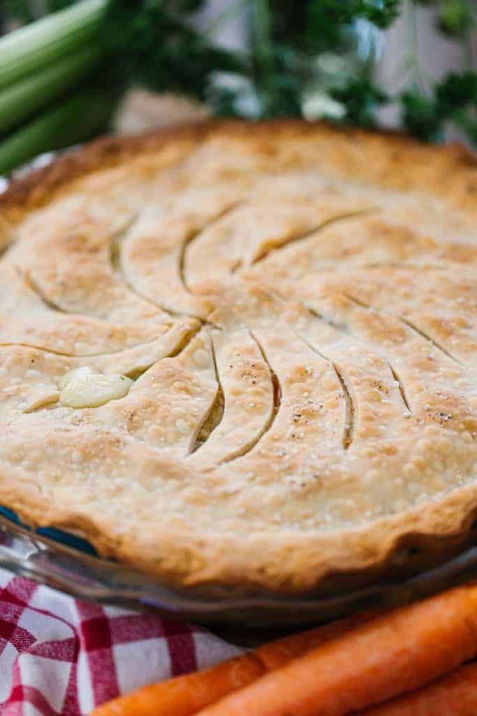 close up of a full pot pie with carrots 