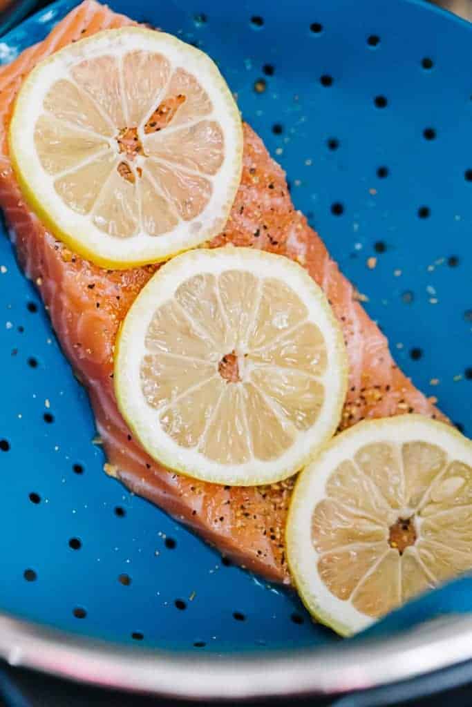 prepped raw salmon on a an Instant Pot steamer net