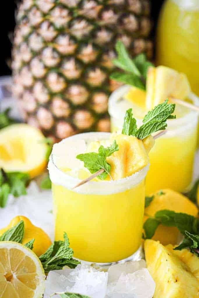 pineapple ginger lemonade with a pineapple in the background