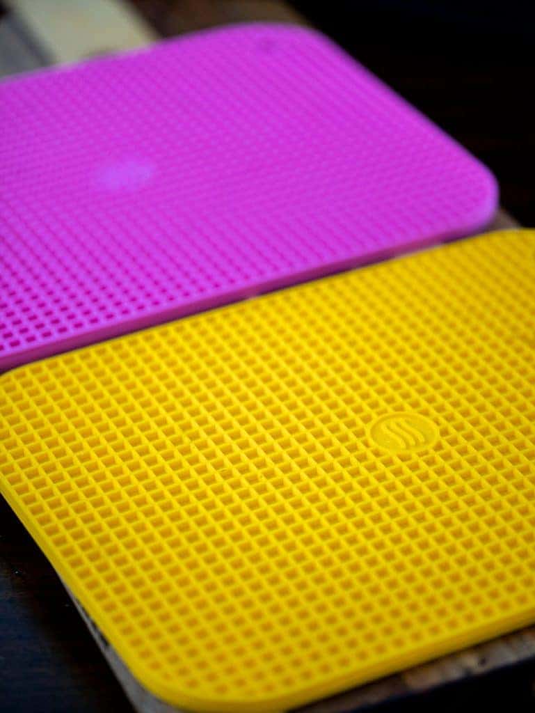 yellow and pink silicone trivets