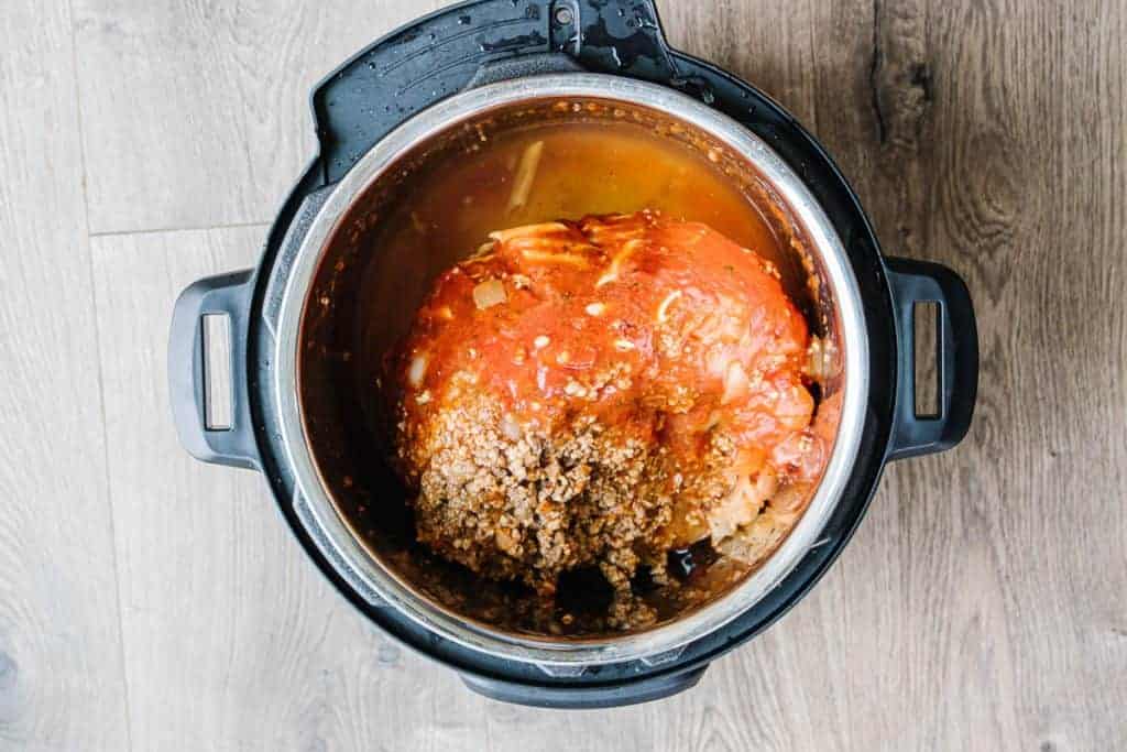 top view of an Instant Pot with frozen block of lasagna soup