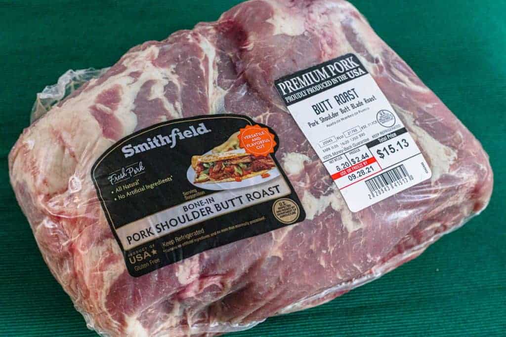 Packaged raw bone-in pork shoulder butt roast