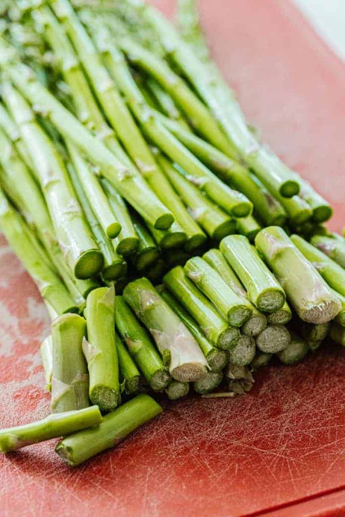 a bunch of asparagus with the bottom inch taken off