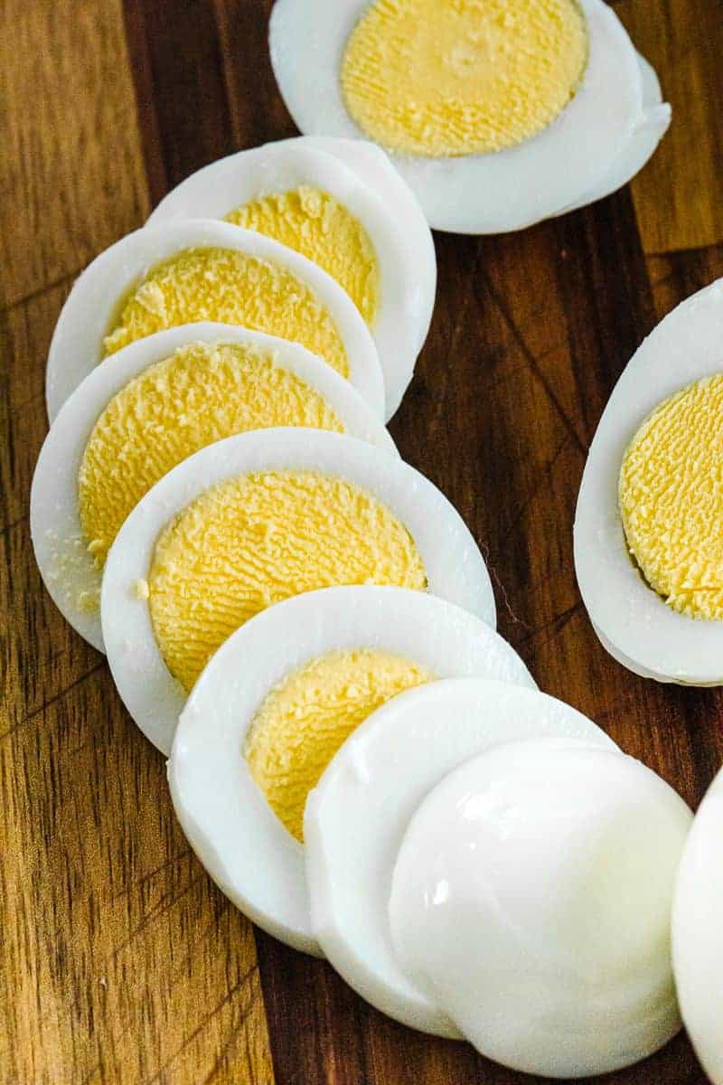Instant pot egg sliced in eight showing circular yokes surrounded by egg white