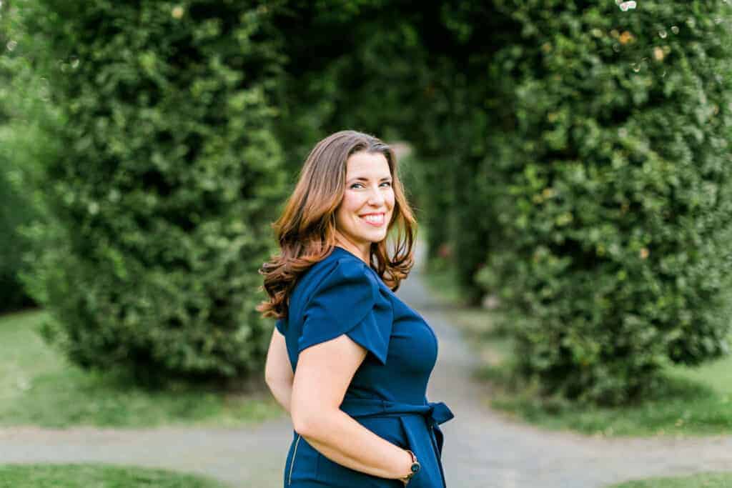 Jennie Whiting smiling in a grove of trees