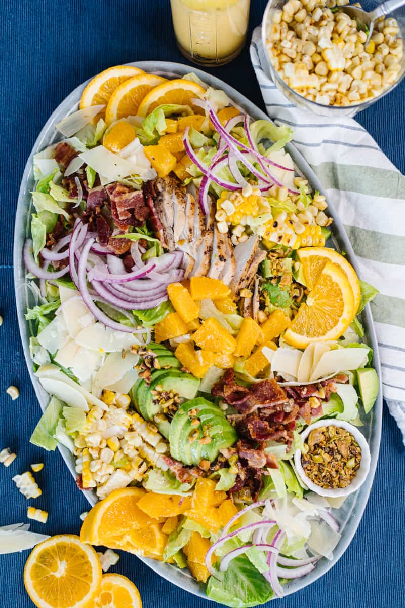 top view of assembled catana salad in white bowl on blue cloth