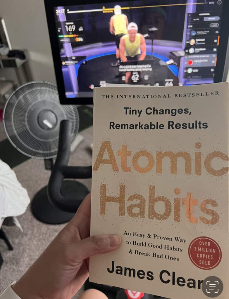 reading atomic habits on the peloton bike for 75 hard